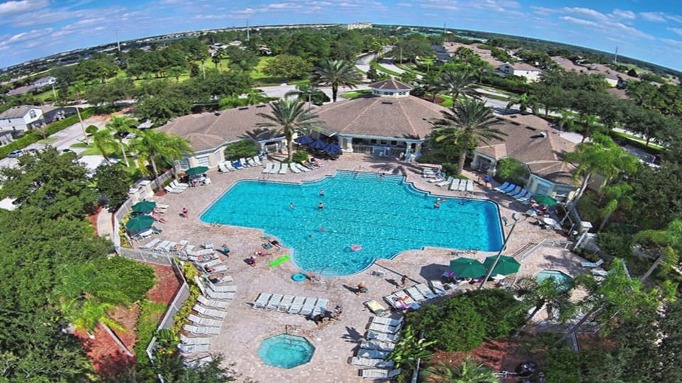Resort pool complex featuring large pool, hot tub/spa, & splash pad