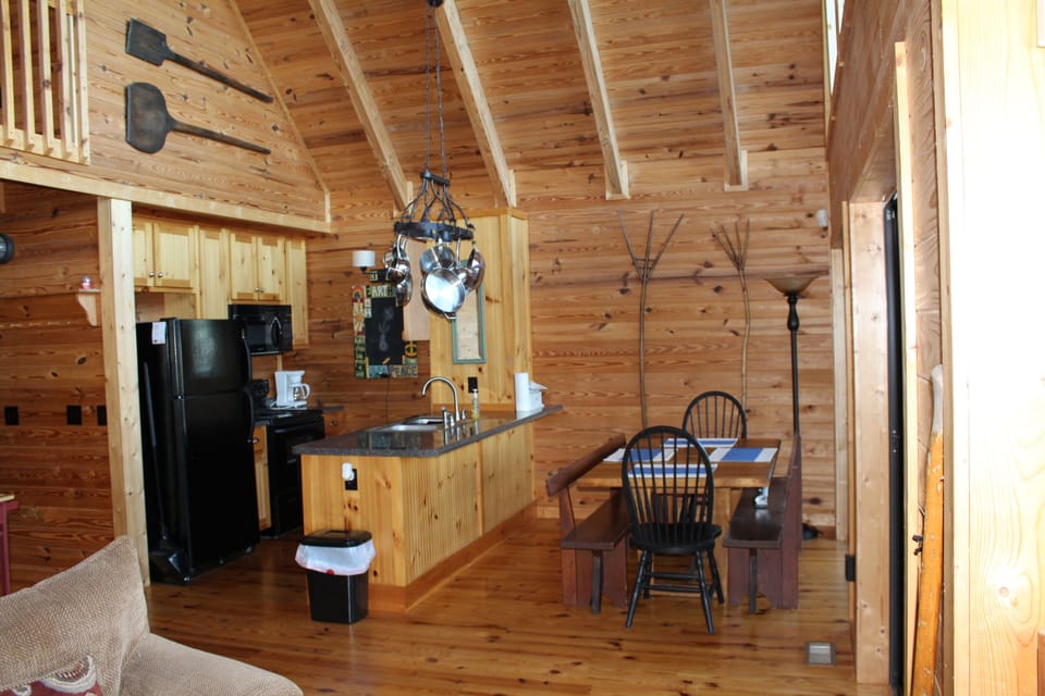 View from fireplace into kitchen and dining area