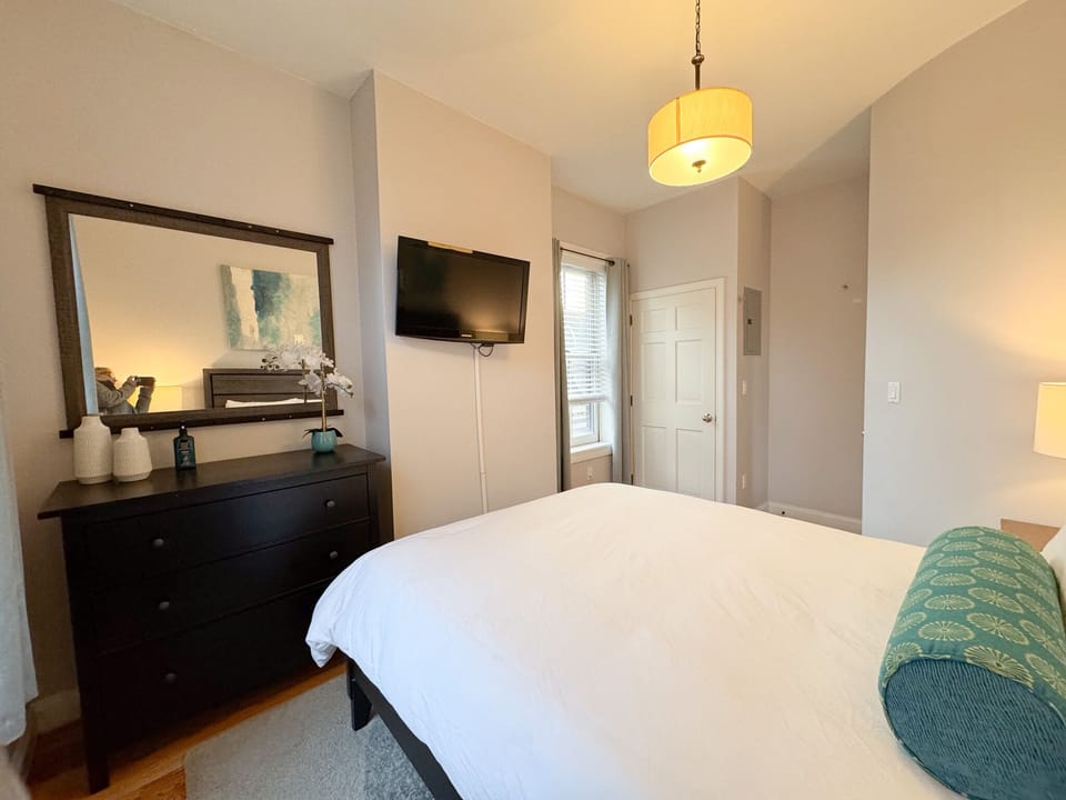 Bedroom 2: Located just off the kitchen, TV mounted to wall, queen sized bed 