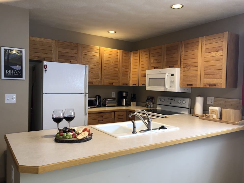 Your kitchen includes pots, pans, glasses and dinnerware.