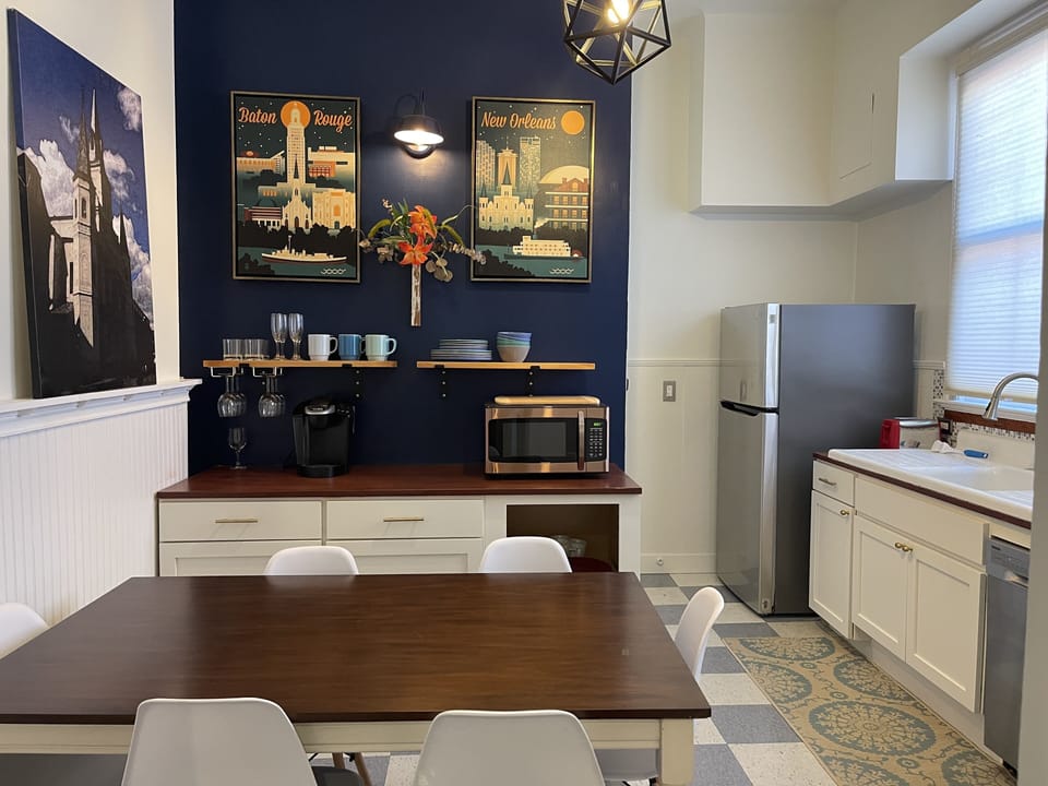 Kitchen w/gas range/oven, microwave, drip coffee maker, utensils, plates, etc.