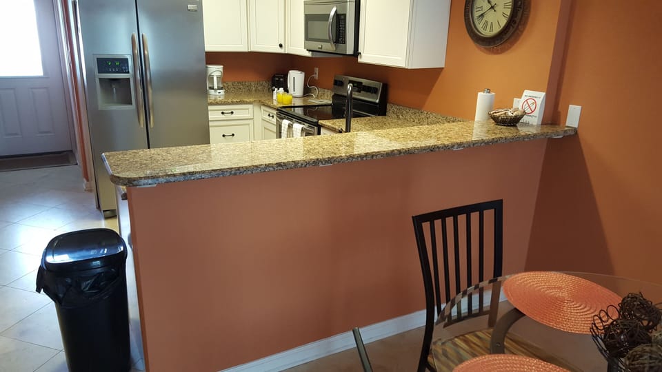 Kitchen with Granite and SS aplliances fully equipped. 