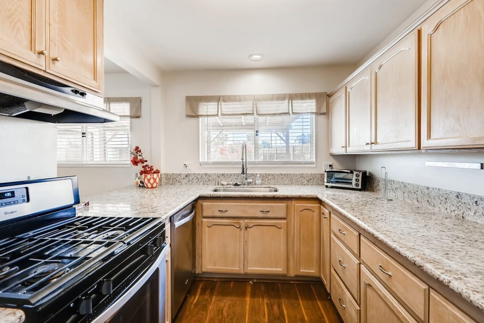 Granite counters, new stainless sink & faucet with bar & stools from kitchen opening up to the dining area. All Brand new stainless appliances in kitchen!