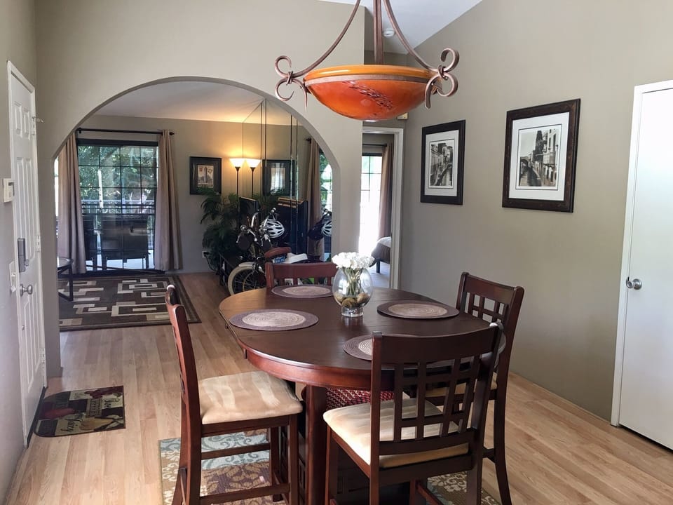 Brand new dining table serving 4 people. And a new lamp over the table.. 