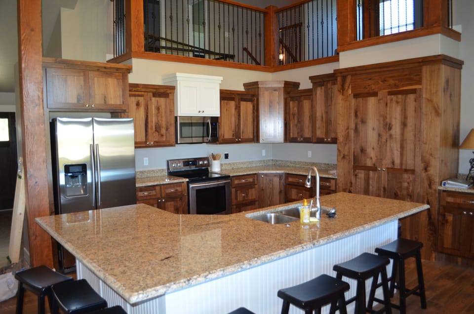Kitchen is fully stocked with dishes, utensils, pans, etc.