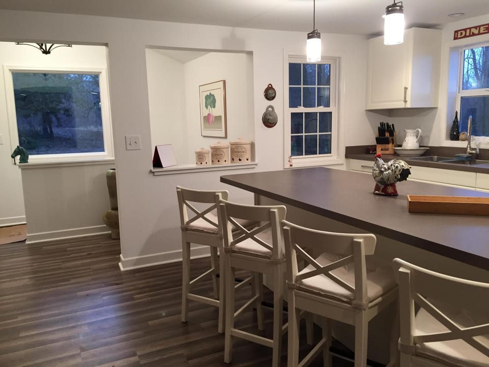 Fully stocked kitchen with all you need to create a meal. Island with 4 stools.