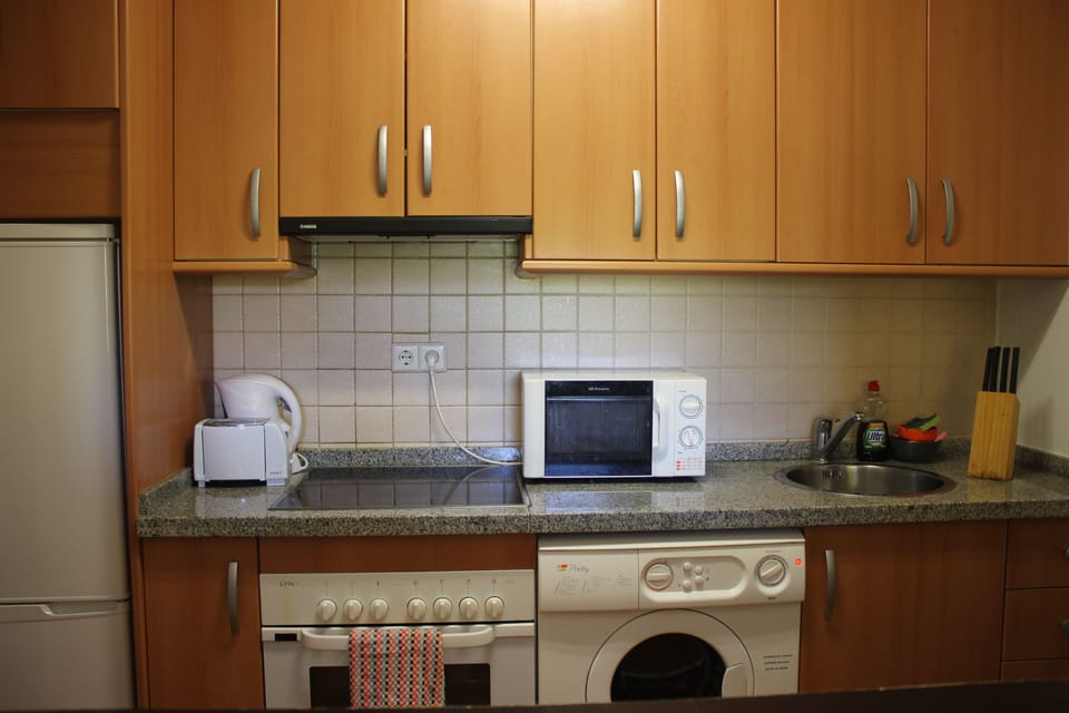 Kitchen; microwave, toaster, kettle, washing machine, fridge freezer & hob/oven