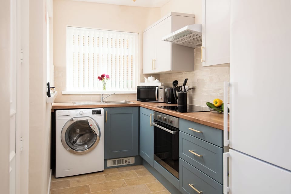 Modern kitchen with washer/drier; large fridge freezer; oven hob; microwave etc.