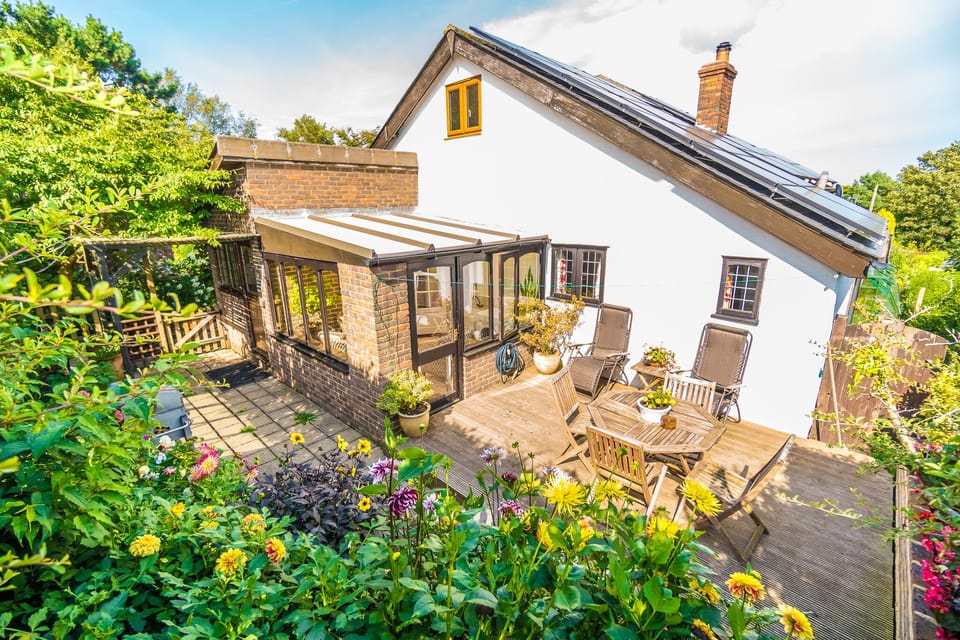 Your private back garden of Badgers Den Cottage has sun loungers, dining table and BBQ area. 