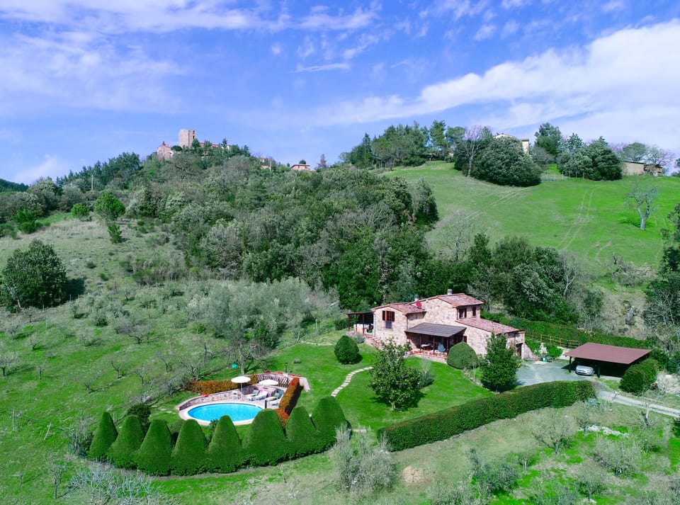 Aereal view of Tuscany villa: lawn and pool
