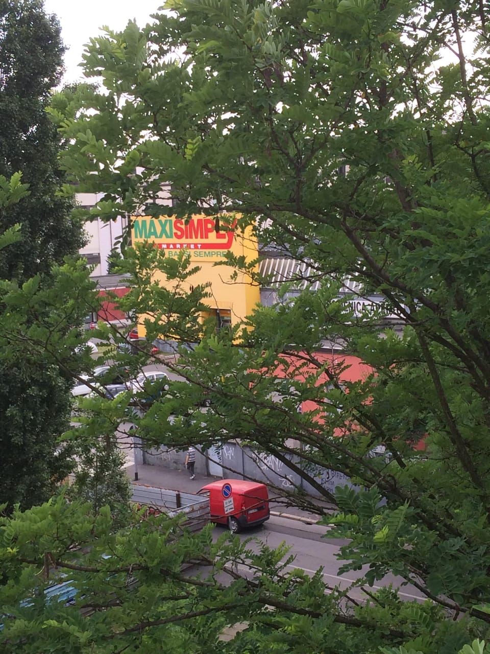 The Supermarket near the house, with a laundry and a Bar inside.