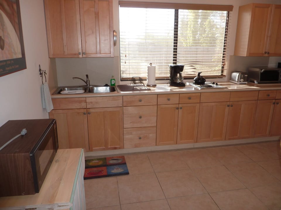 kitchenette with corian counter