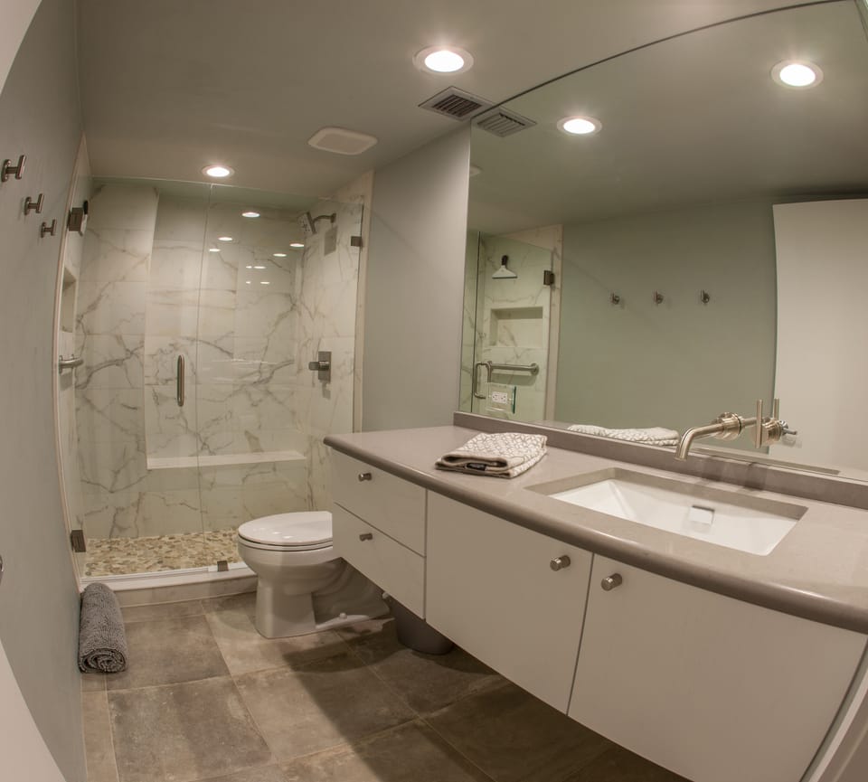Marble, pebbles, integrated Shower seating, waterfall faucet. Pamper yourself!! 