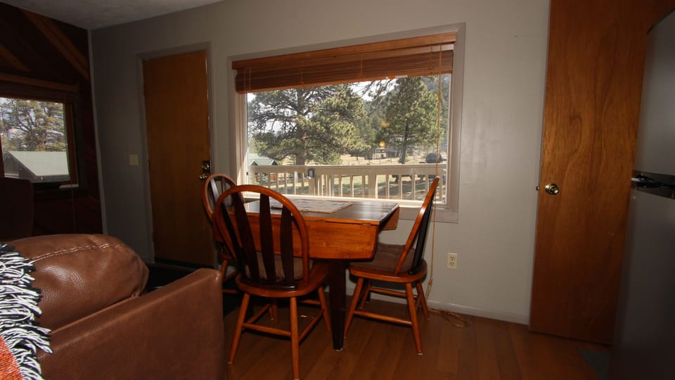Dining for 4. Others can sit on sofa, enjoy a meal on the porch or back yard.