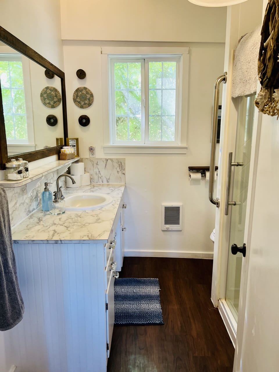 Bathroom with shower sink and toilet. 
