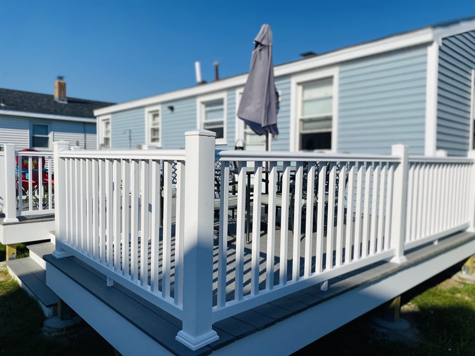 Large deck with seating for 8 with views of the ocean!!