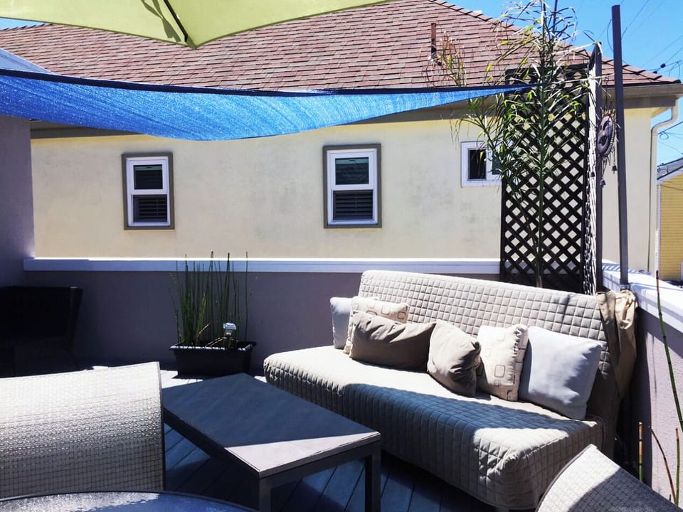 Roof Deck with Large couch daybed and Super Sun shade, umbrella 