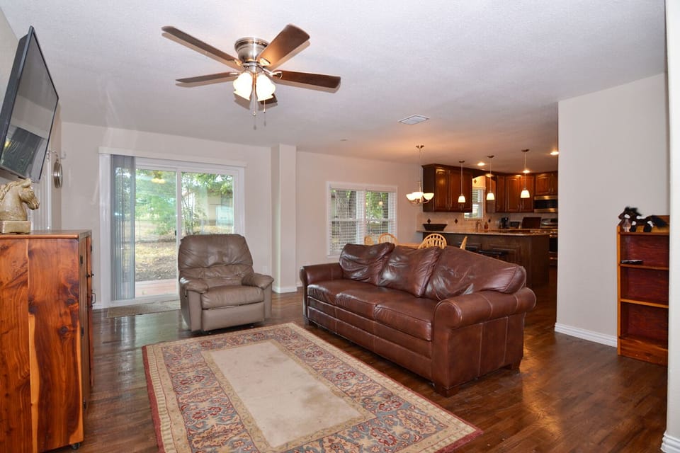 Side view of living room with a big screen TV for your entertainment.