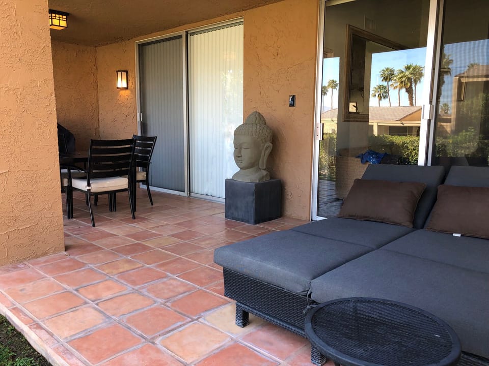 Covered Patio also has a barbecue and a 4 person Outdoor Dining Table.