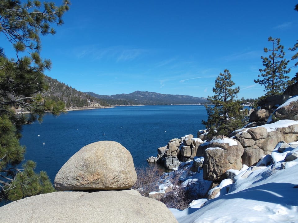 Beautiful view of lake from hiking trail after fresh dusting of snow