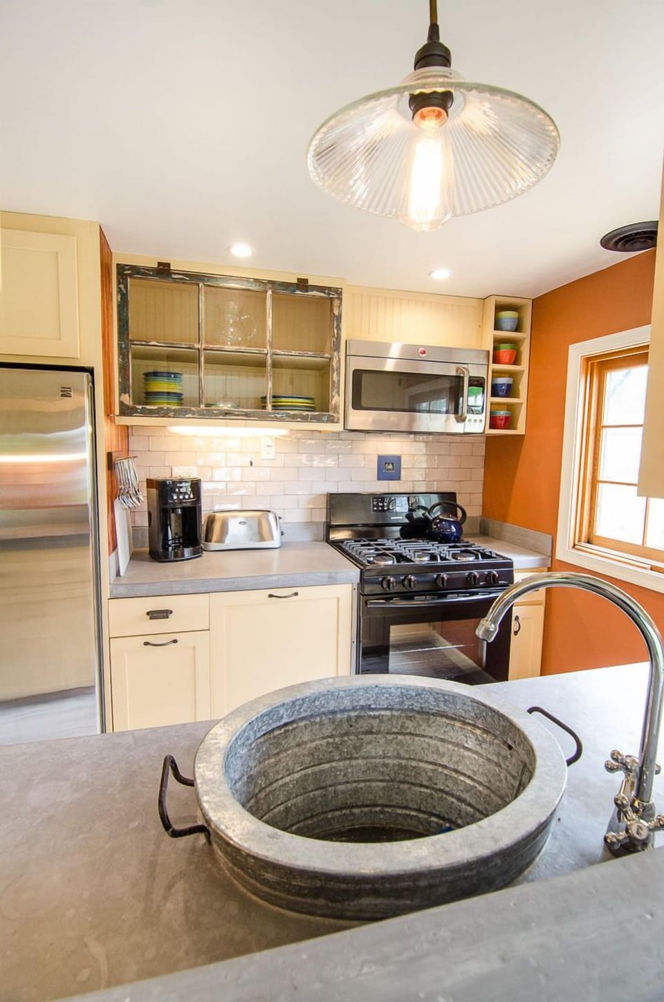 Kitchen with microwave, toaster, coffee machine and whole bean coffee grinder