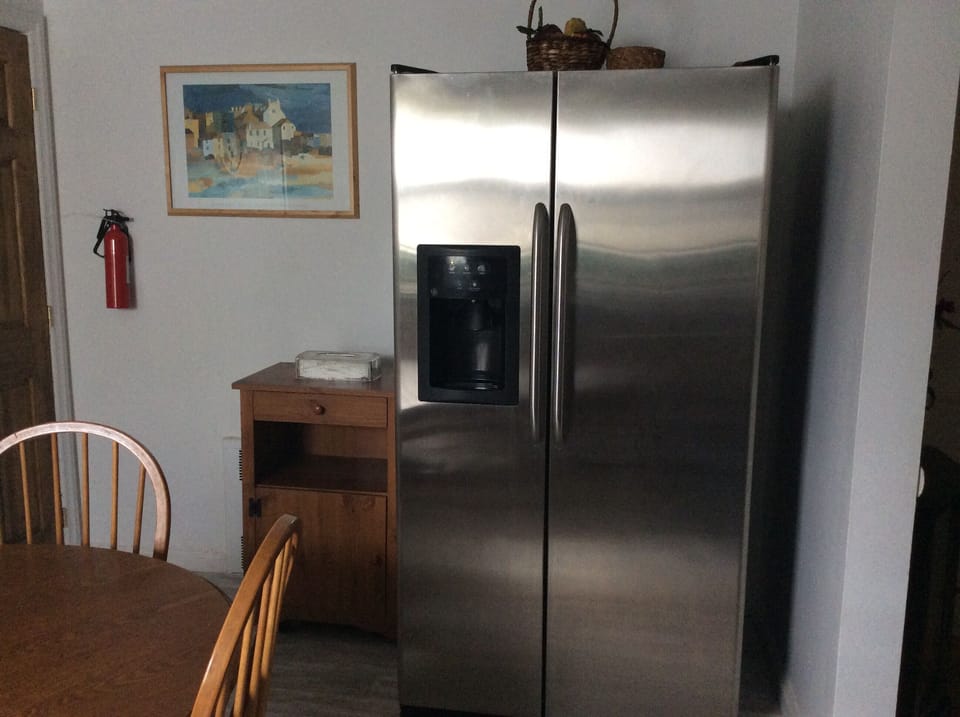 Large refrigerator and freezer with water dispenser and ice maker