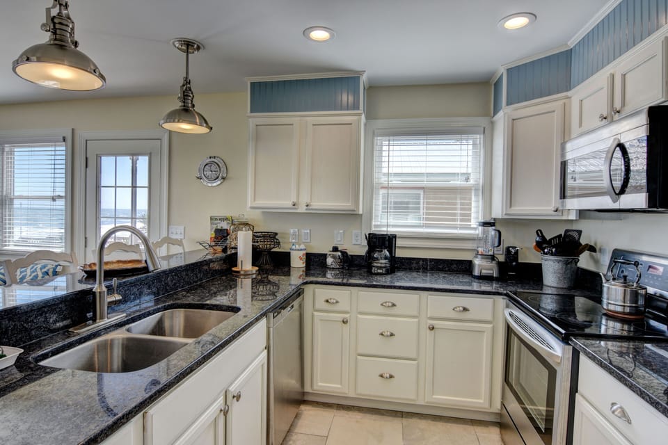 Well stocked kitchen with every appliance you enjoy at home and them some?