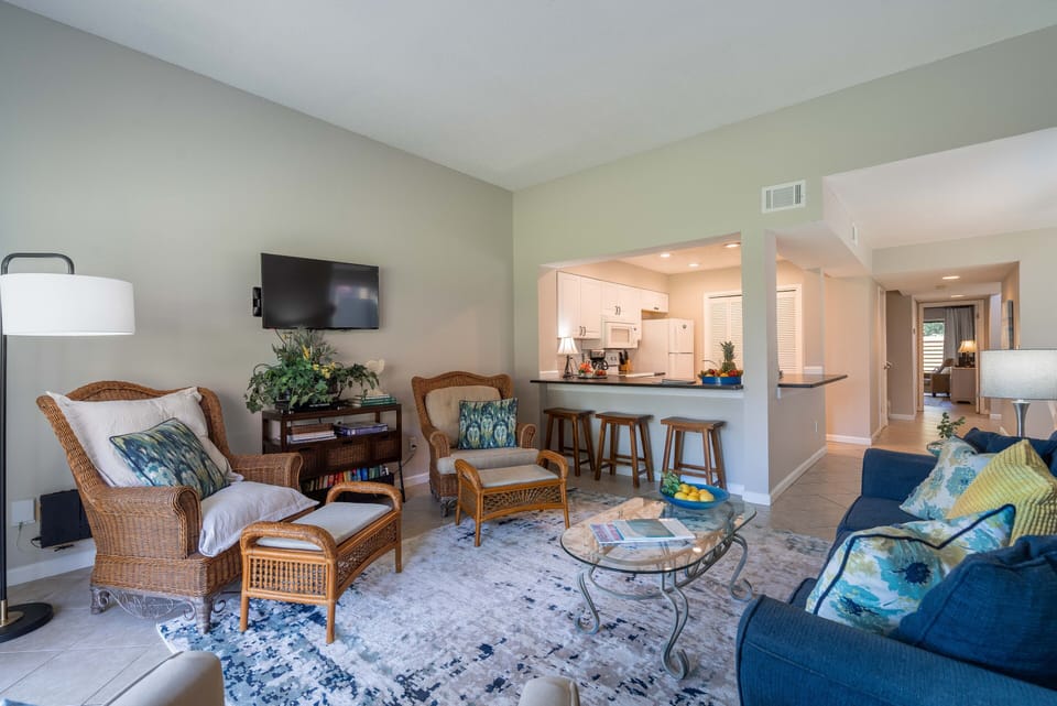 Open floor plan includes bar stools for extra dining space.