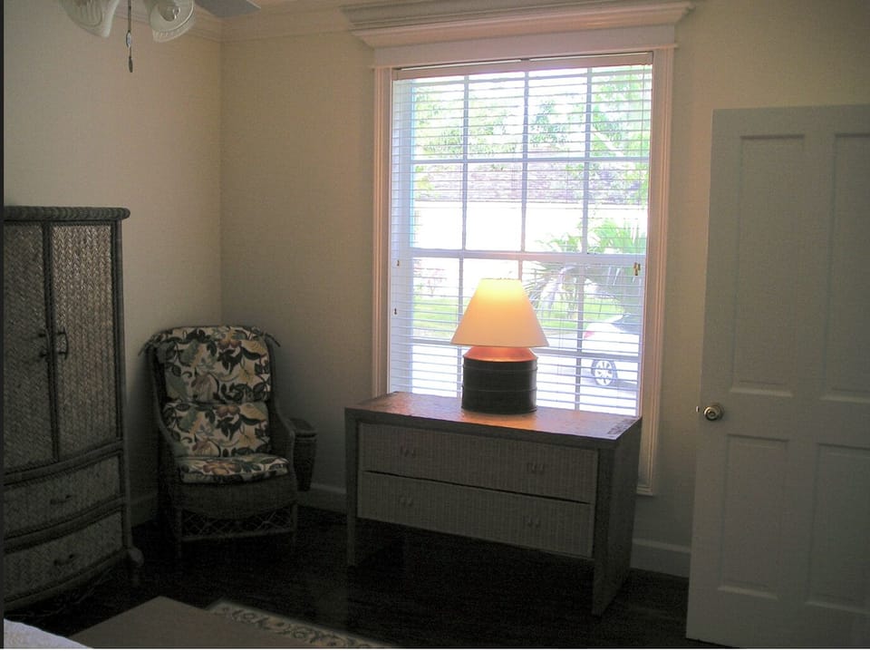 The window with the outside shutters makes for a dark bedroom all day.

