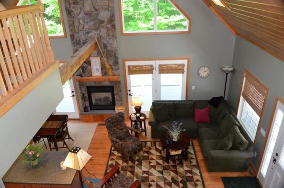 Beautiful stone fireplace and wall of windows main floor
