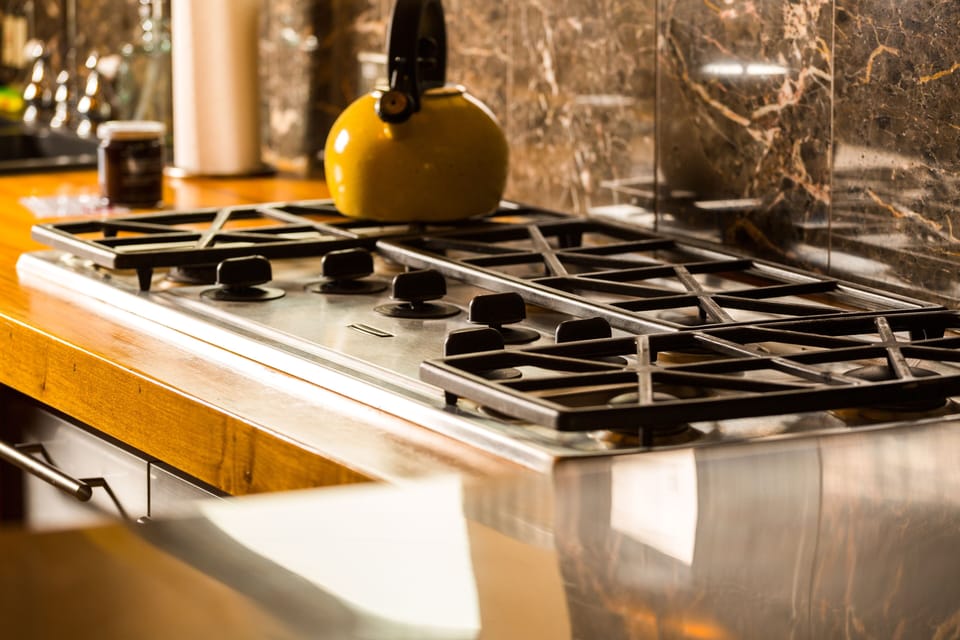 Commercial-grade, 6 burner gas range. Create a feast and share a meal, here!