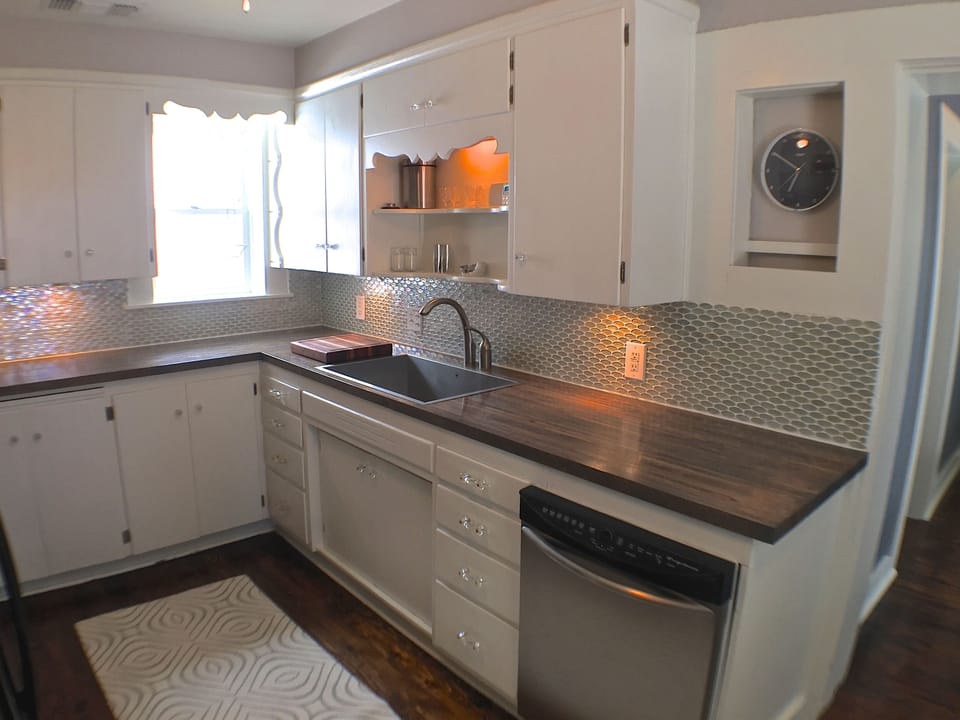 The kitchen cabinets are from the 40's, but everything else is modern.