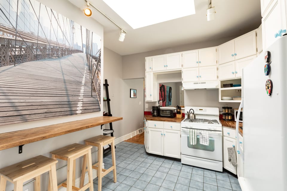 Kitchen with breakfast bar and huge overhead skylight