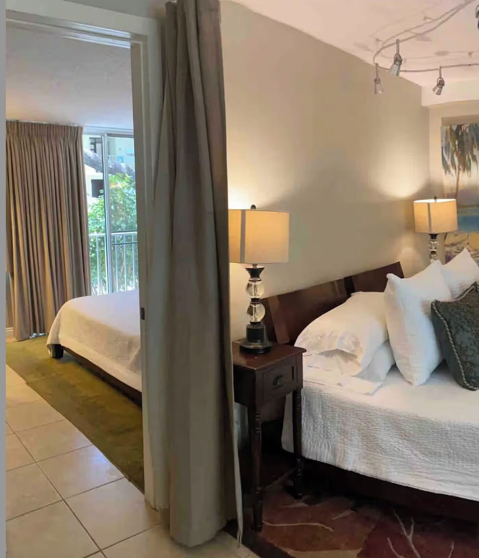 You must walk through Bedroom #1 to get to the entrance of Bedroom #2. 