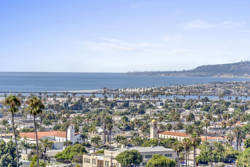 View of Mission/Pacific beaches along with fishing boats leaving the harbor.