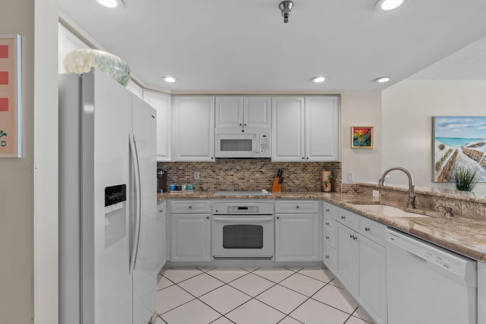 Beautiful kitchen, open to dining room with gulf views. All comforts of home!