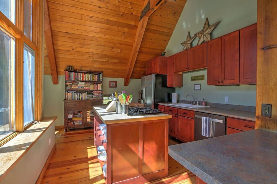 Spacious, well-equipped kitchen overlooking mountain scenery