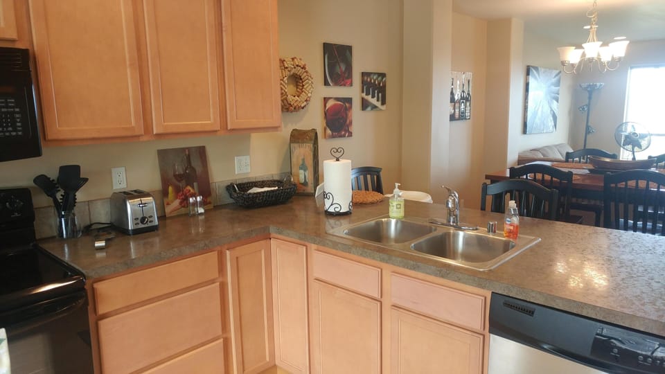Kitchen with newer appliances, mountain and water view.