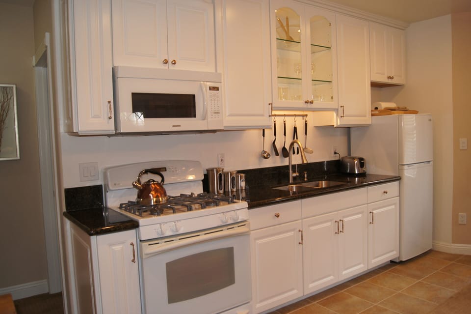 Gas Range, Granite Counters and Built-in Microwave.