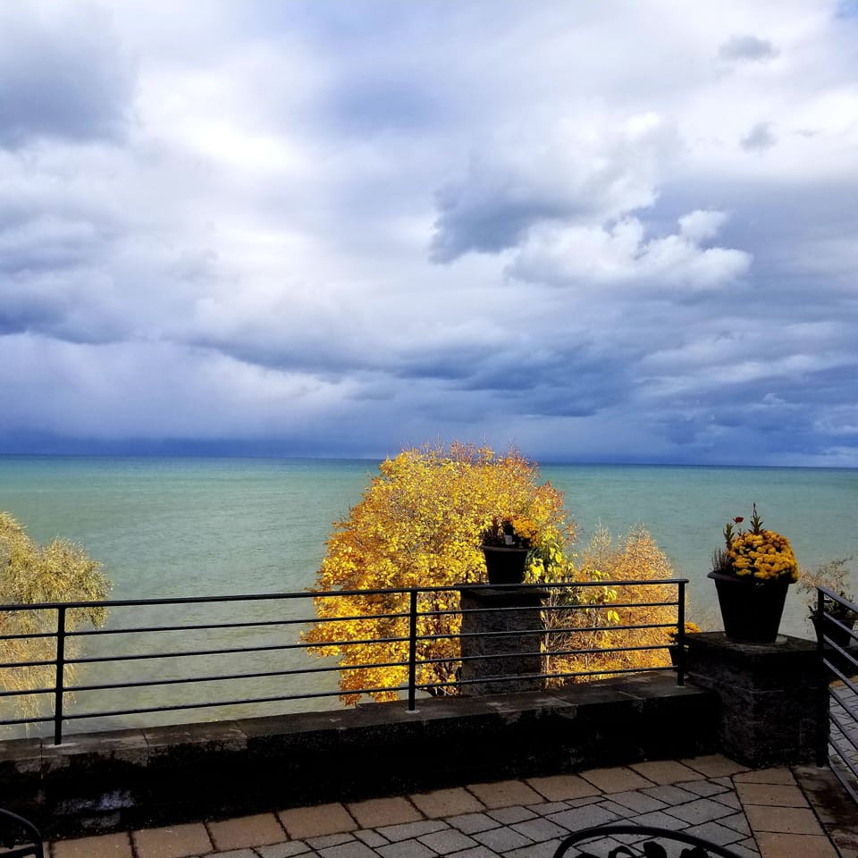 Upper patio by the outdoor kitchen in autumn with ever changing skies
