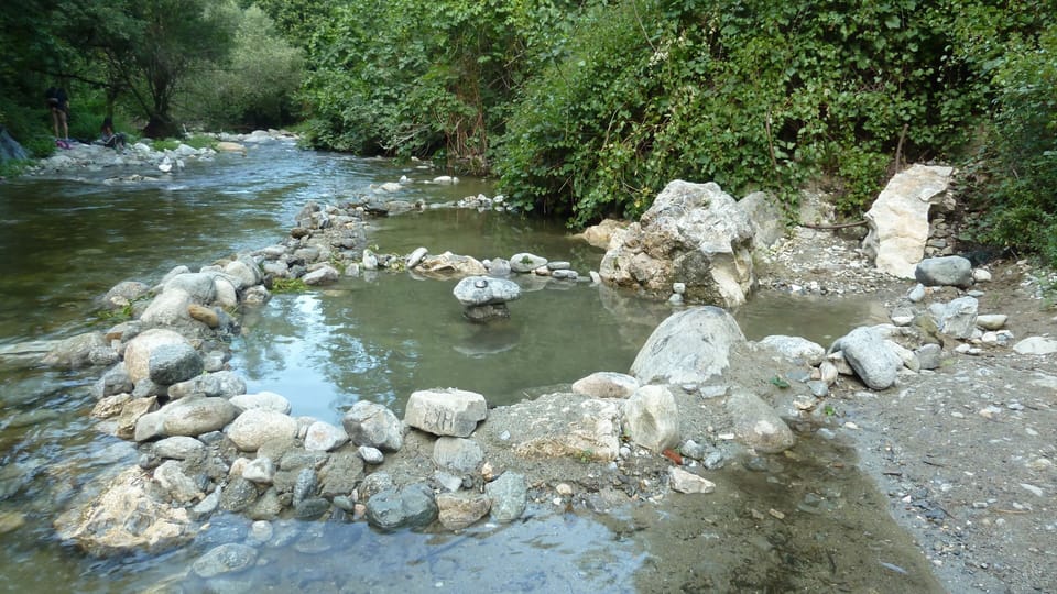Natural thermal pools in the river below the house