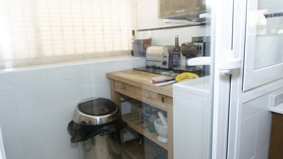 Utility room which contains washing machine and microwave and coffee machine