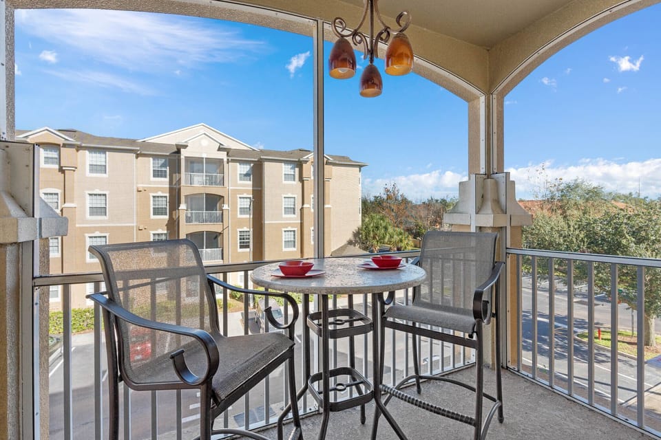 Condo balcony overlooking a partial view of Magic Kingdom's fireworks