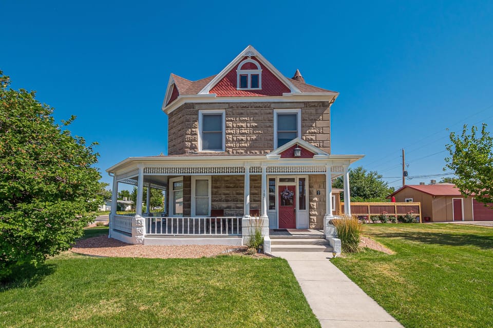 A stunning exterior with classic details and beautiful landscaping, creating a cozy and inviting atmosphere.