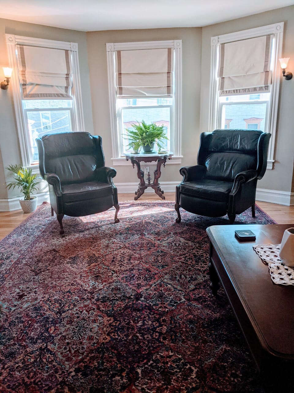 Accent chairs in leather gives everyone a place to relax