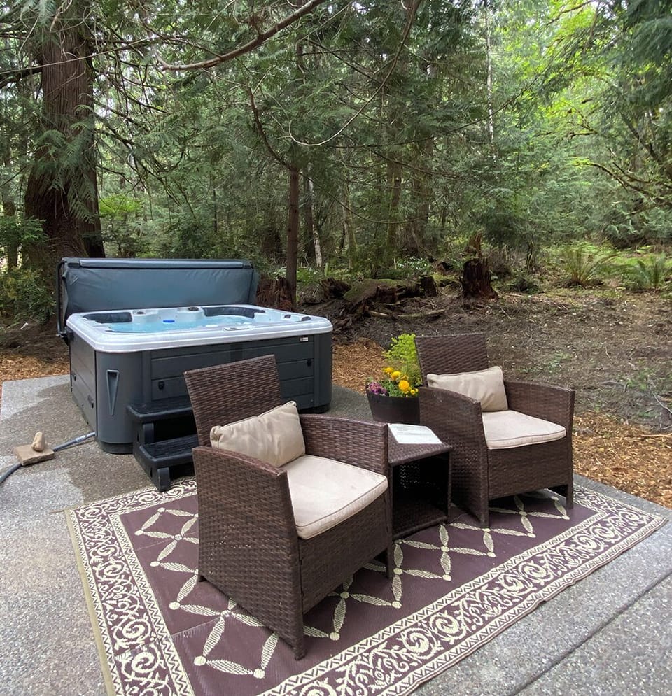 Secluded hot tub surrounded by peaceful woodland