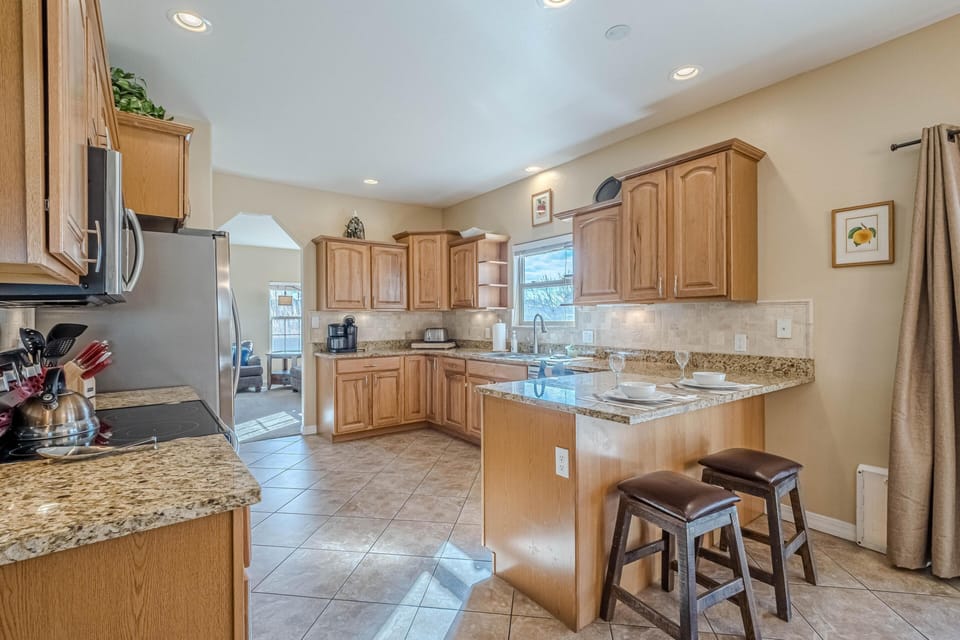 Soft morning light spills across the kitchen—coffee practically makes itself here.