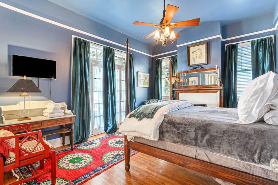 Second floor queen bedroom, providing access to the front balcony