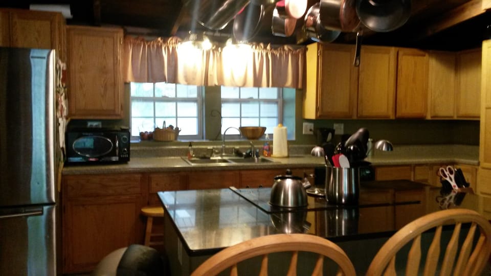 Kitchen with granite island and breakfast bar. Plus lots of small appliances