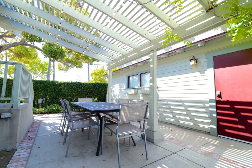 Outdoor patio separates the garage and the back of the house.